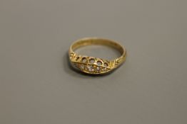 An 18ct gold five stone diamond ring