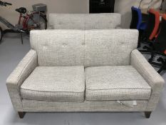 A pair of Marks and Spencers two seater settees in beige fabric
