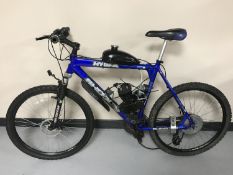 A gent's Shogun Hydra mountain bike fitted with an engine and a petrol tank