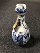 An oriental 20th century blue glazed vase depicting figures in a garden, height 30.
