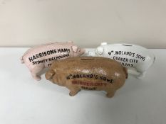 Three cast iron pig monkey banks
