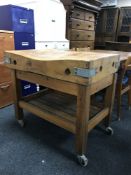 A pine butcher's block trolley