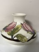 A Moorcroft pottery Magnolia pattern squat bulbous vase,