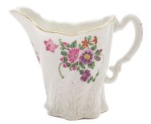 A First Period Worcester 'High Chelsea' ewer: of spiral leaf moulded form with ornate scroll handle,
