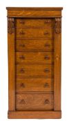 A Victorian oak Wellington chest:, containing seven short drawers,