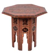 An Indian black and scarlet lacquered wood octagonal table on a folding stand:,