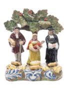 A Staffordshire pearlware 'tithe pig' group: of traditional form,
