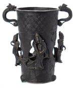 A Chinese bronze two-handled vase: of pierced tapering cylindrical form applied with chilong