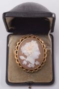 A 19th century gold cameo portrait brooch: depicting a classical woman,