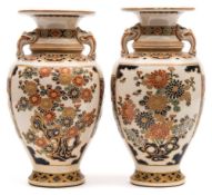 A pair of Japanese Satsuma vases: of baluster form with mythical beast mask handles,