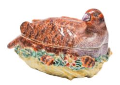 A Derby partridge tureen and cover: the bird with brown and puce plumage and seated on it's nest,