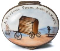 An English enamel patch box inscribed 'A Present from Lowestoft': of oval form with interior mirror,