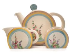 A Clarice Cliff three-piece tea service in the Hollyhocks pattern: of Bonjour shape each painted