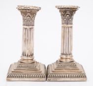 A pair of Victorian silver Corinthian column candlesticks, maker Goldsmith and Silversmiths Co, Ltd,