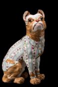 A faience pug in the Galle manner: modelled as a seated 'barrister' and sporting a wig,