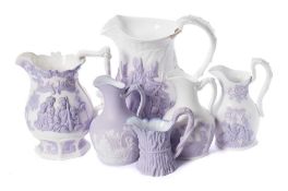 Six Samuel Alcock lavender and white relief moulded jugs: comprising The Battle of Acre,
