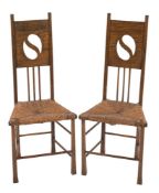 A pair of Glasgow School oak occasional chairs retailed by Liberty:,