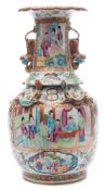 A Cantonese porcelain vase: of baluster form with frill neck supported by four chilongs,