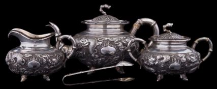 A Chinese silver three piece tea service, maker Kwan Wo, Hong Kong,