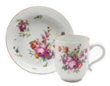 A Longton Hall coffee cup and saucer: painted in 'Trembly Rose' style with floral sprays and sprigs,