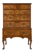 An early 18th Century walnut and cross and feather banded chest on stand:,