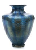 A Loetz Phanomen glass vase: of twelve lobed form with waisted neck and flared rim,