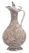 An Indian silver claret jug: of ovoid form,