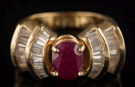 A ruby and diamond cluster ring: with central oval ruby approximately 8.1mm long x 6.