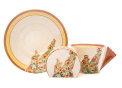 A Clarice Cliff Bizarre cup,