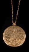 A 9ct gold circular, foliate design locket on chain:, 22gms gross weight.