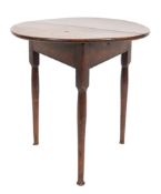 An 18th Century elm circular cricket table:, the triangular base on turned tapered legs,