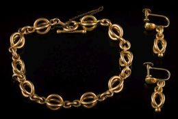 An 18ct gold circular-link bracelet and a pair of matching screw-back earrings:, 37gms gross weight.