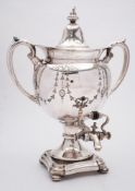 A silver plated two-handled samovar: of traditional design with domed lift-off lid,