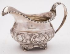 A William IV silver cream jug, maker William Traies, London, 1831: with gadrooned border,