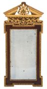 A 19th Century walnut and parcel-gilt architectural wall mirror:, in the George II taste,