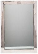 An Indian silver table mirror, unmarked: crested and inscribed Raj of Dhrangadhra, of easel type,