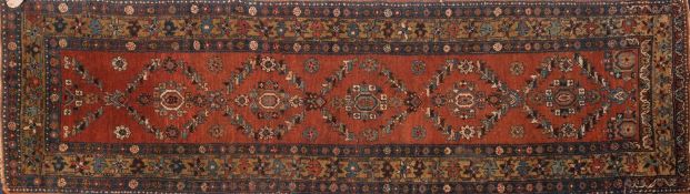 A Heriz runner (North West Persian):,