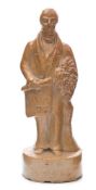A salt glazed stoneware spirit flask in the form of Sir Robert Peel: modelled standing with his arm