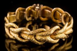 A bracelet of chased noose linking in 19th century style: the clasp link inscribed 'G.Y.S.