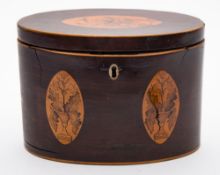 An early 19th century mahogany and inlaid tea caddy: of oval outline,