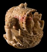 A Japanese carved ivory okimono of the seven lucky Immortals on their treasure ship: with dragon's