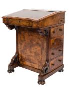 A Victorian walnut, tulipwood crossbanded and inlaid Davenport:, bordered with ebonised lines,