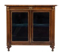 A Regency rosewood and gilt metal mounted dwarf display cabinet: with a satinwood crossbanded top,