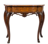 An 18th Century and later Italian walnut and marquetry side table:, of serpentine outline,