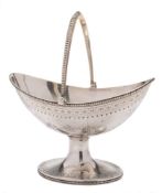 A Victorian silver swing-handled basket, maker Henry Holland, London, 1872: crested,