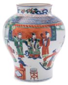 A Chinese Wucai baluster jar: painted with an official and two attendants being entertained by lady