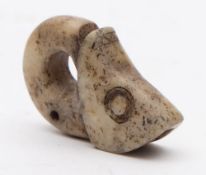 An Inuit hardstone ring carving: of a mythical fish-like creature, 6cm. long.