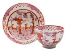 A Lowestoft tea bowl and saucer: painted in pink,