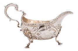 A George III silver sauce boat, maker George Smith II, London, 1763: crested,