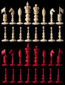 A 19th century Indian carved ivory 'Burmese' pattern chess set: stained red and left natural,